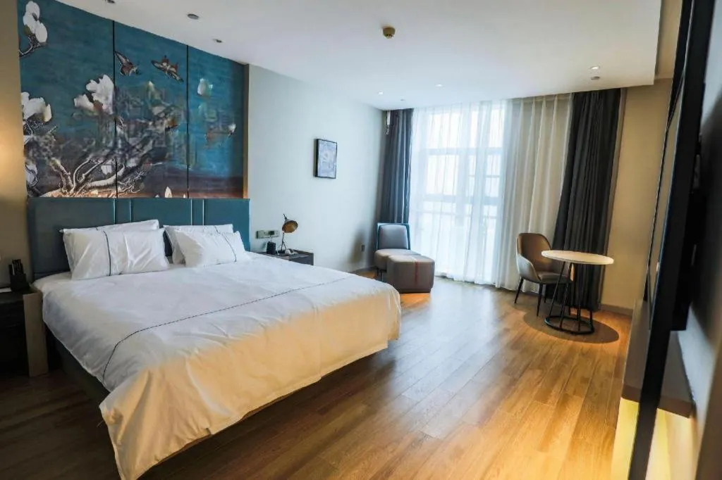 Bed in Magnotel Tongxiang Shimao Center