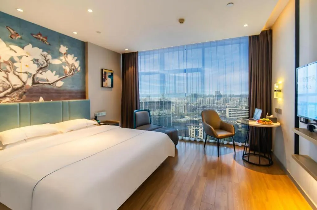 Bed in Magnotel Tongxiang Shimao Center