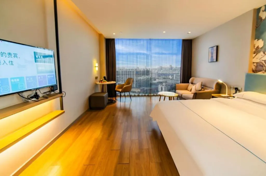 Bed in Magnotel Tongxiang Shimao Center