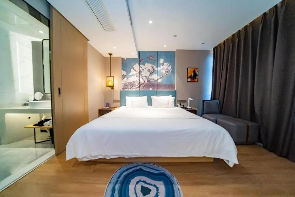 Bed in Magnotel Tongxiang Shimao Center