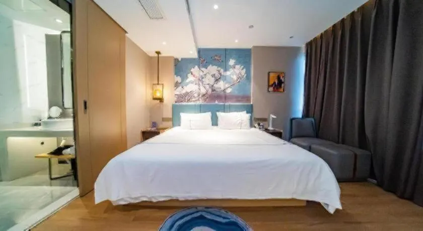 Bed in Magnotel Tongxiang Shimao Center