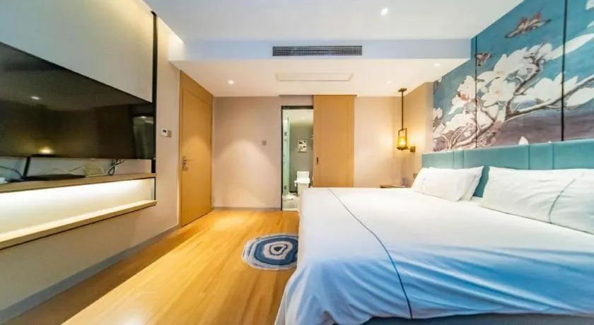 Bed in Magnotel Tongxiang Shimao Center