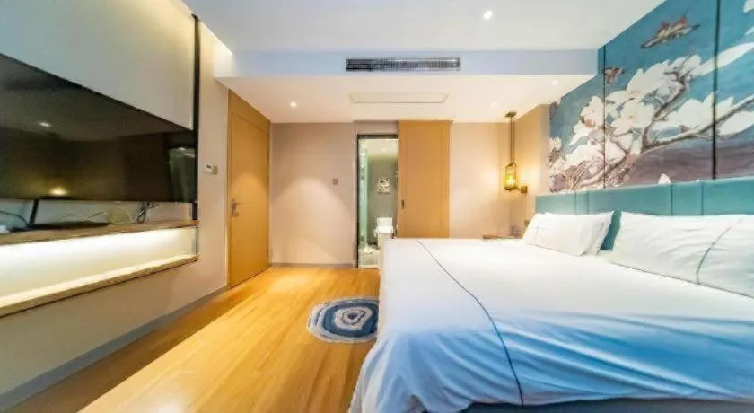 Bed in Magnotel Tongxiang Shimao Center