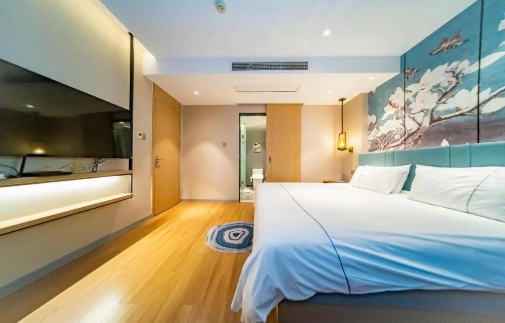 Bed in Magnotel Tongxiang Shimao Center