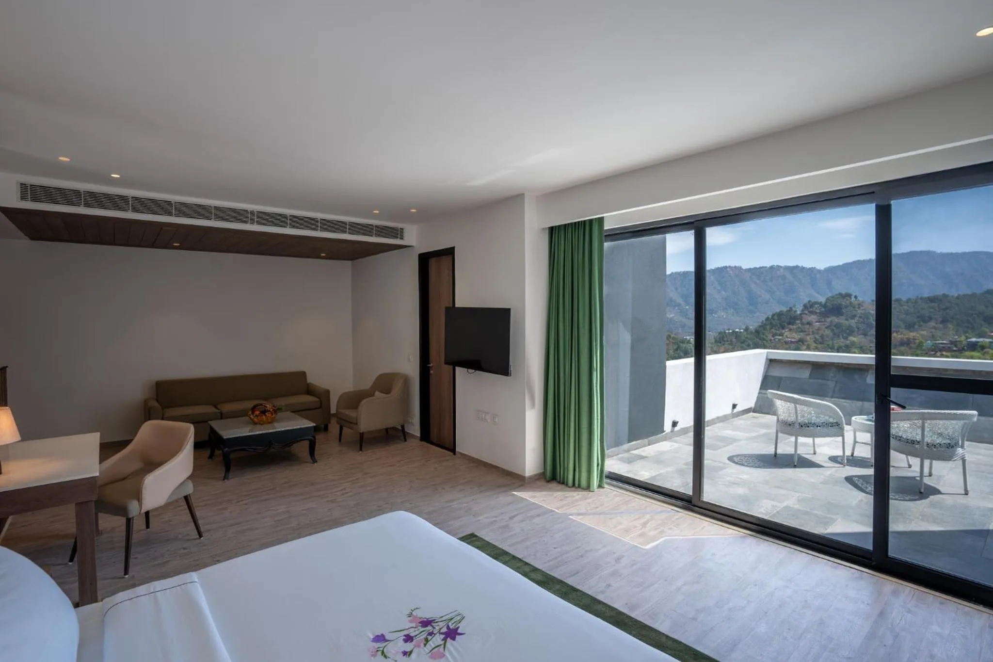 Seating area, Bed in Velmore Kasauli Operated by Royal Orchid Hotel Ltd.