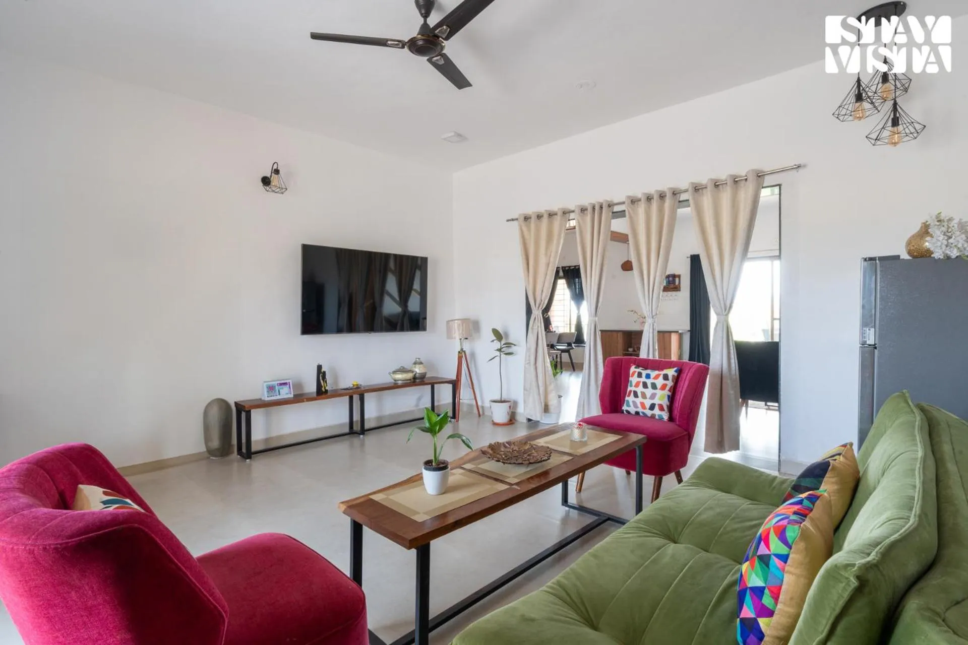 Living room in StayVista at Mangifera Agro Estate with Pool, Wi-Fi