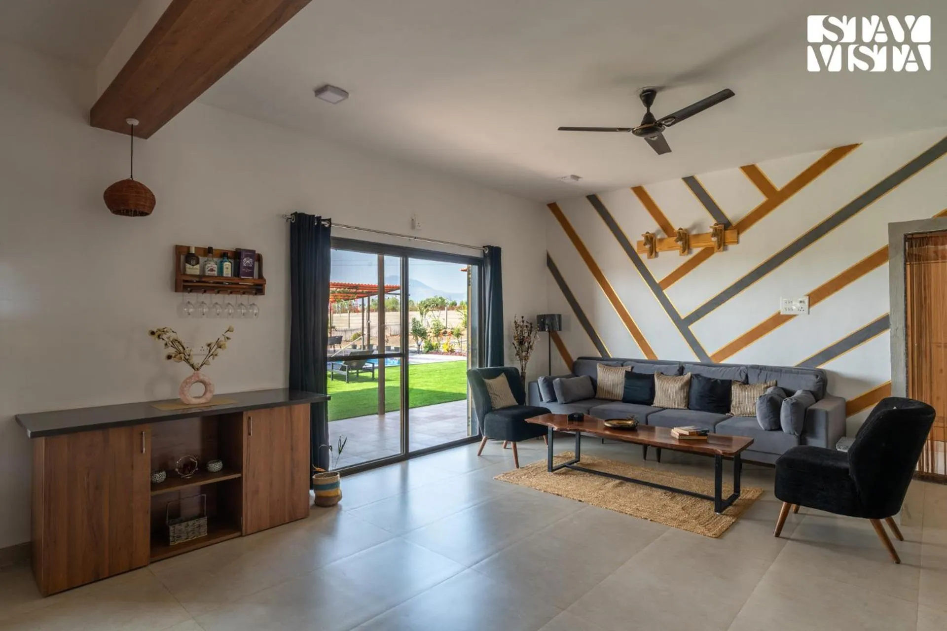 Living room in StayVista at Mangifera Agro Estate with Pool, Wi-Fi