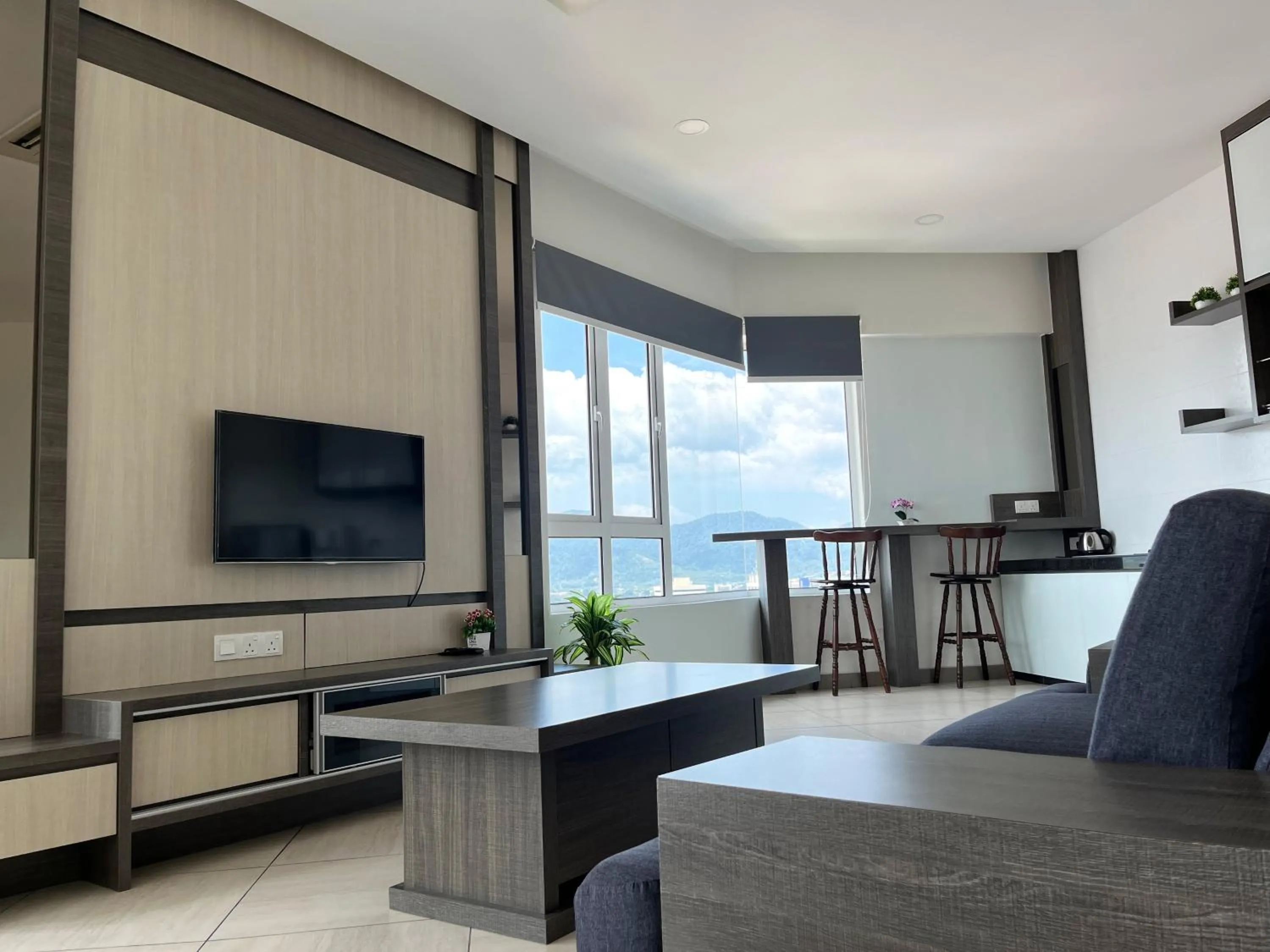 Communal lounge/ TV room in The Octagon Suites at Ipoh City Centre, 6 pax