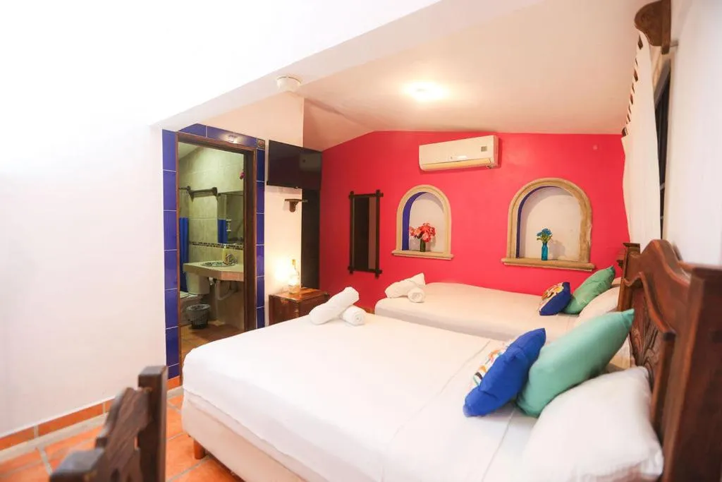 Bed in Íkaro Suites Colonial