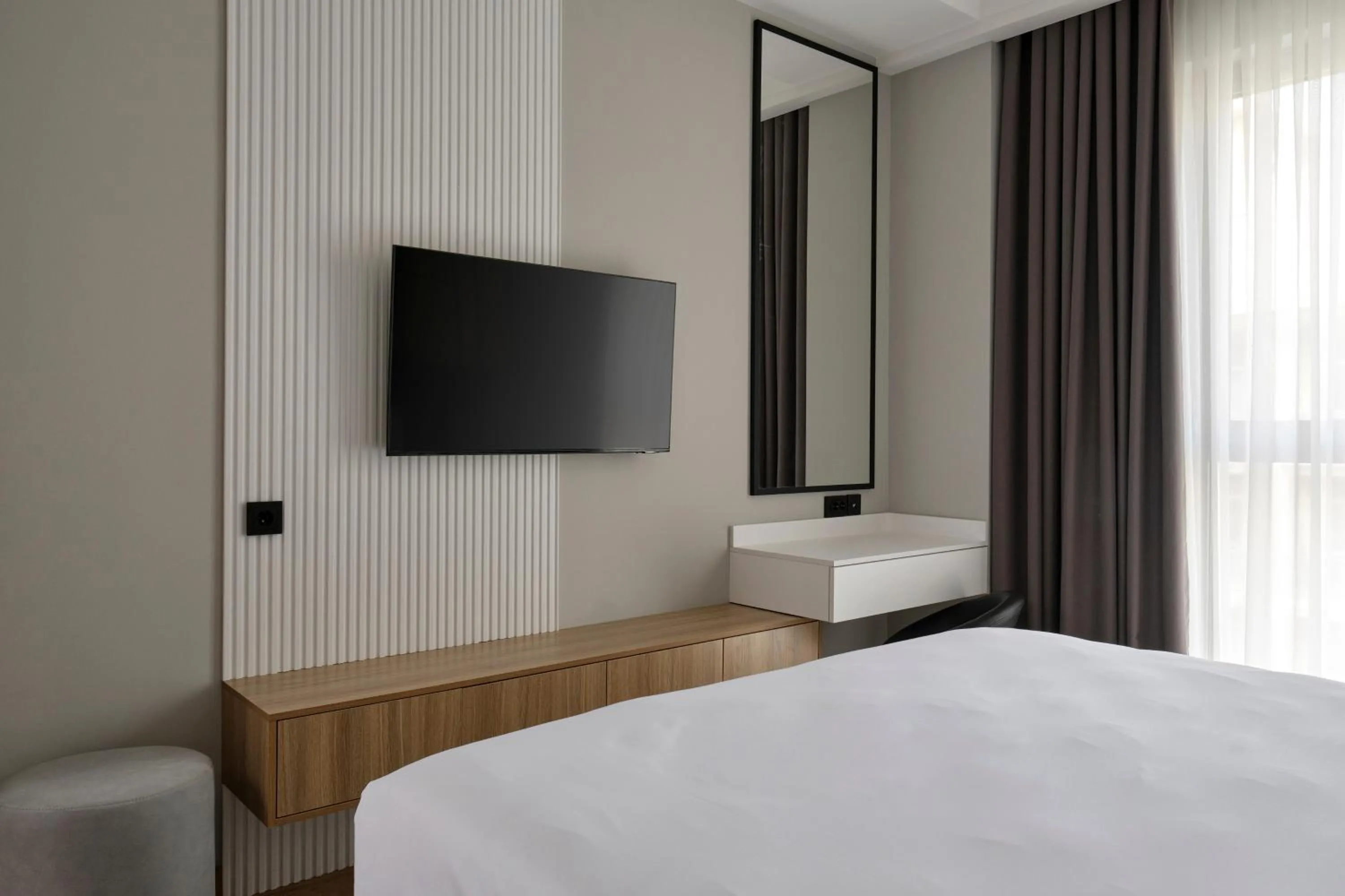 Bed in STYLO Residences & Suites