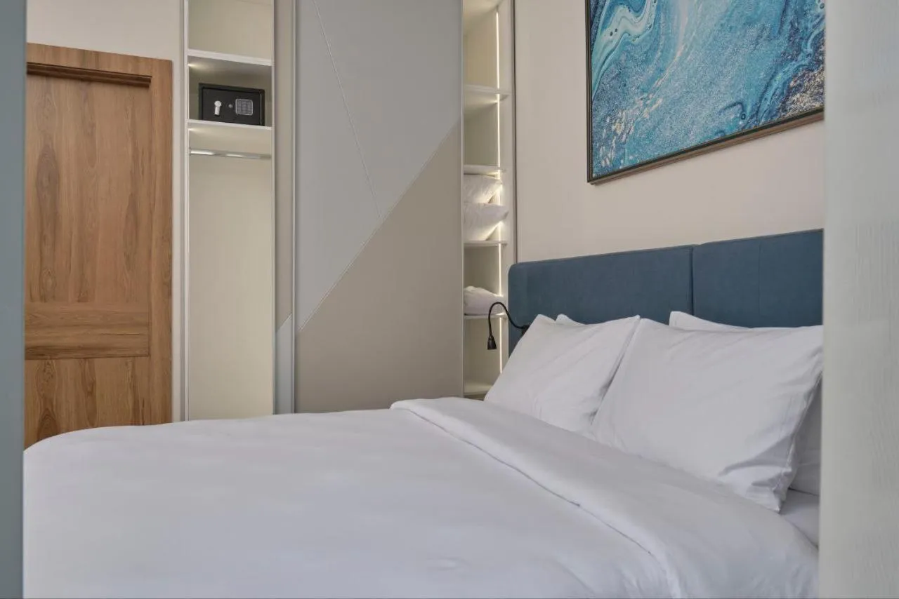 Bed in STYLO Residences & Suites