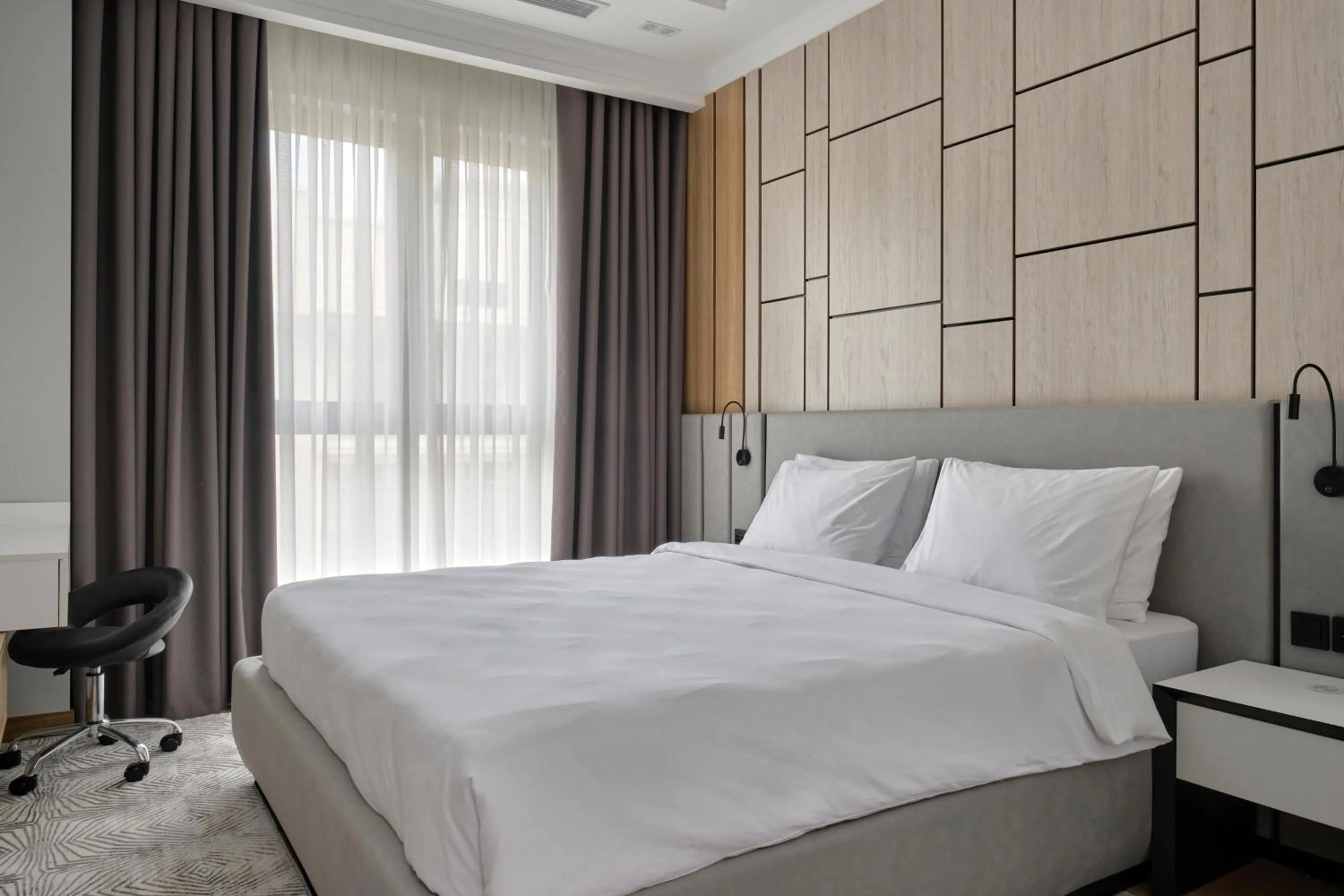 Bed in STYLO Residences & Suites