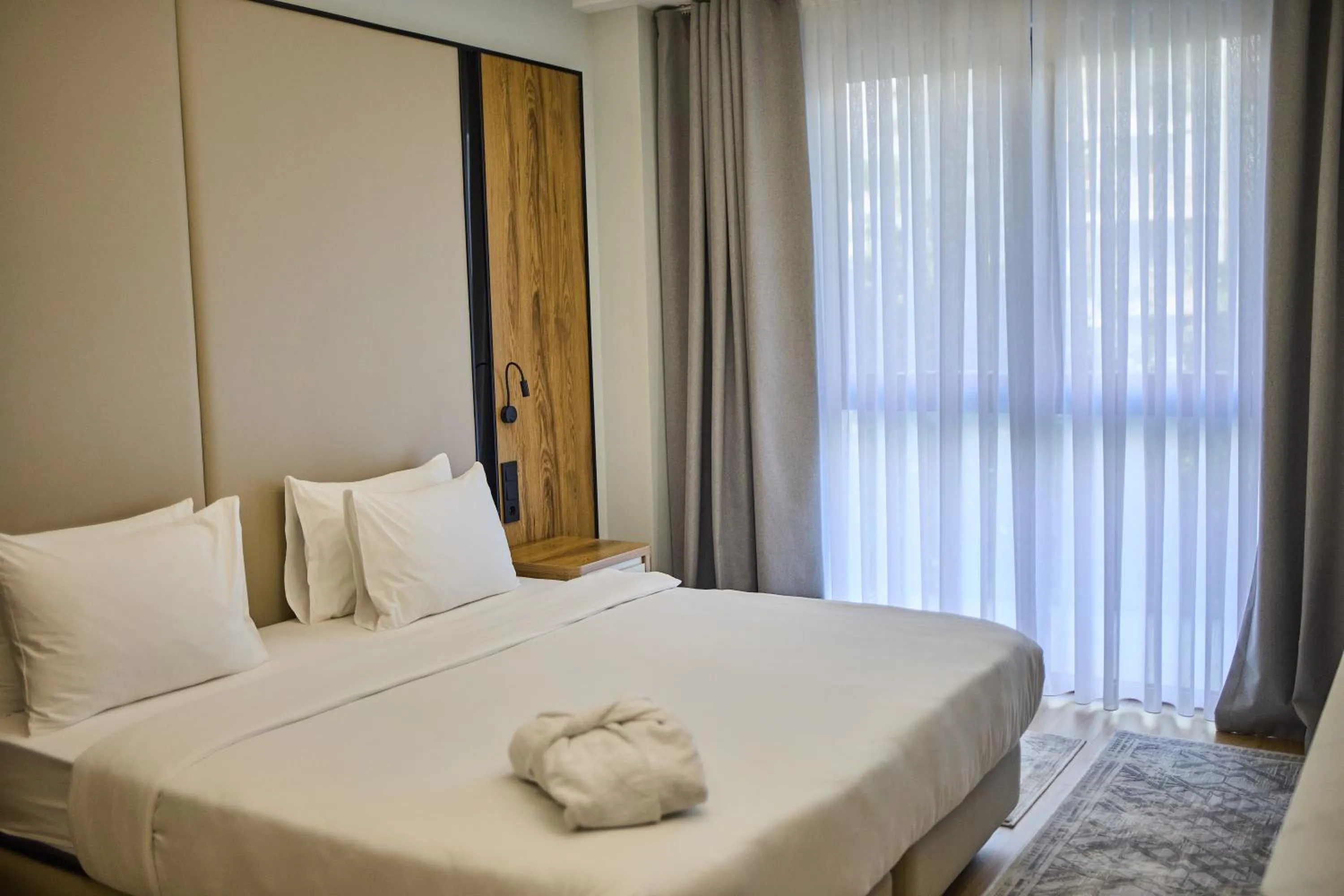 Bed in STYLO Residences & Suites