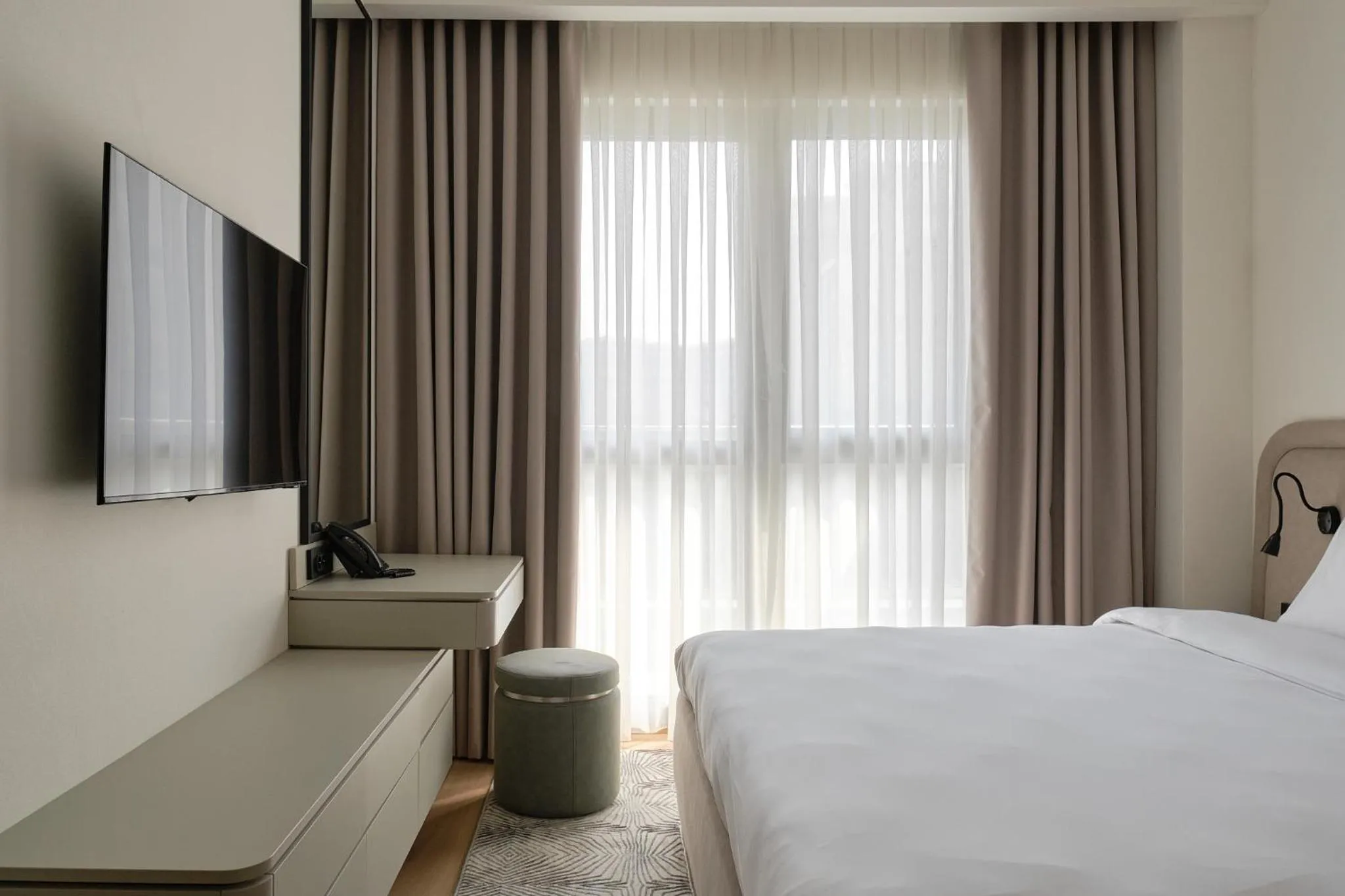 Bed in STYLO Residences & Suites