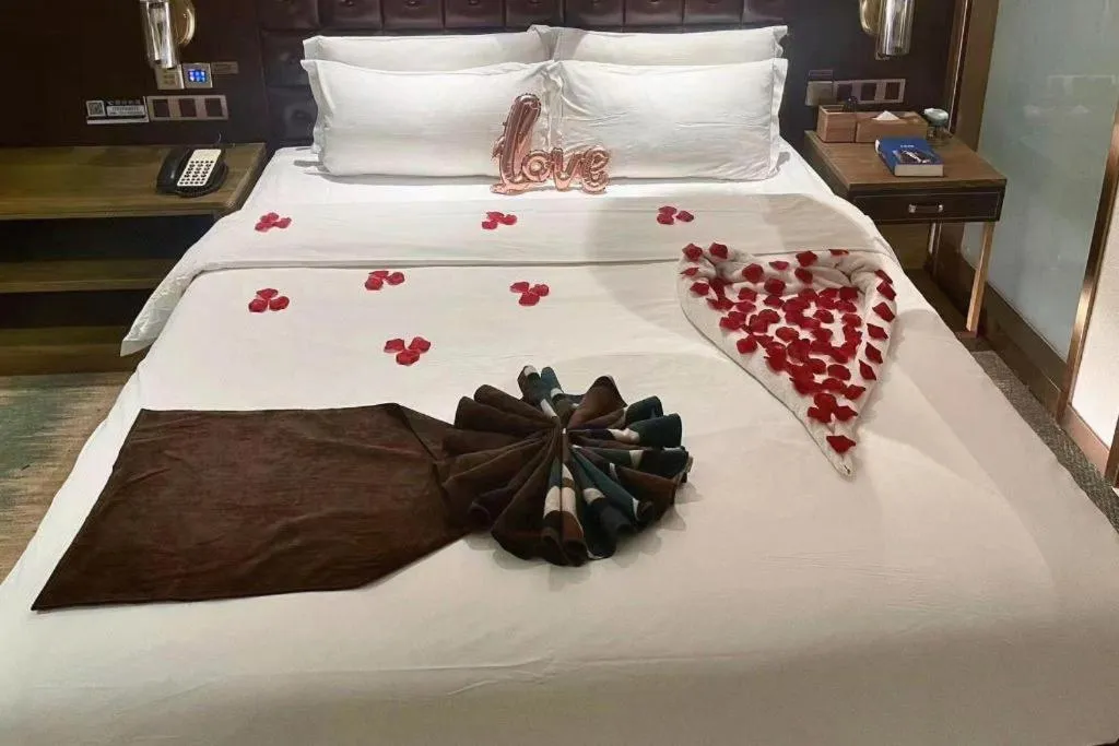 Bed in James Joyce Coffetel Shijiazhuang Wanda Plaza Tangu Metro Station