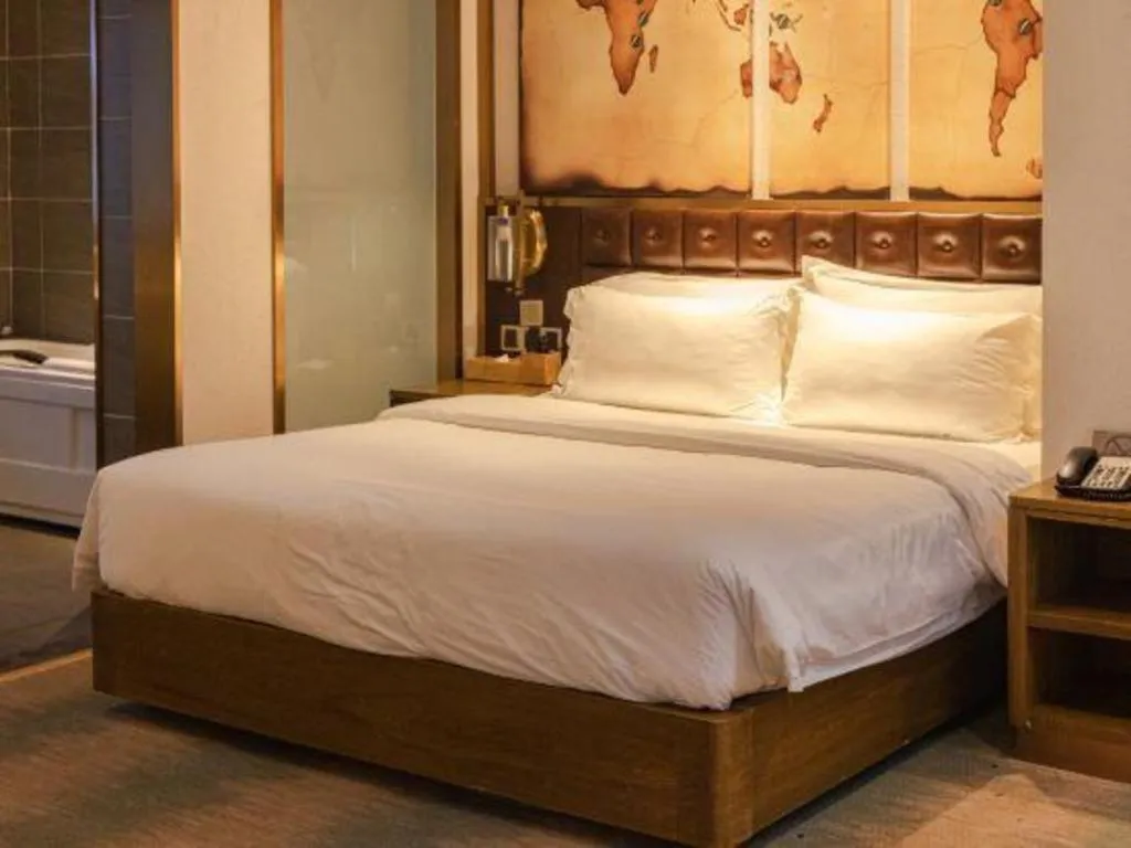 Bed in James Joyce Coffetel Shijiazhuang Wanda Plaza Tangu Metro Station