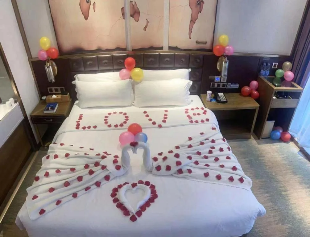 Bed in James Joyce Coffetel Shijiazhuang Wanda Plaza Tangu Metro Station