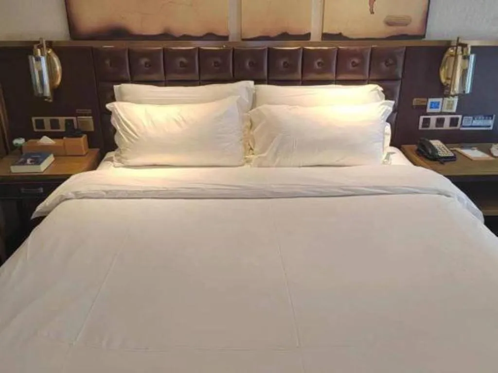 Bed in James Joyce Coffetel Shijiazhuang Wanda Plaza Tangu Metro Station
