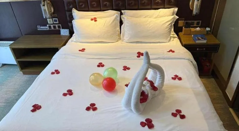 Bed in James Joyce Coffetel Shijiazhuang Wanda Plaza Tangu Metro Station