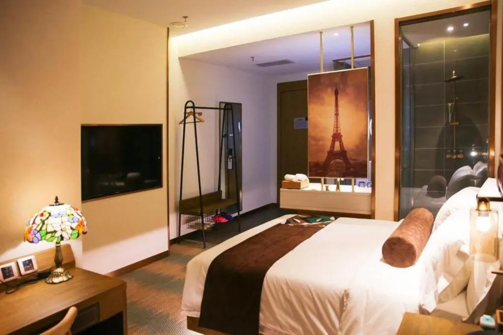 Bed in James Joyce Coffetel Shijiazhuang Wanda Plaza Tangu Metro Station