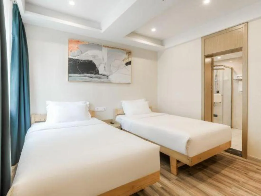 Bed in ZMAX Hotels Wuhan East Lake