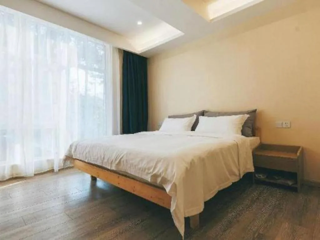 Bed in ZMAX Hotels Wuhan East Lake