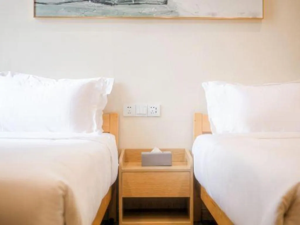 Bed in ZMAX Hotels Wuhan East Lake