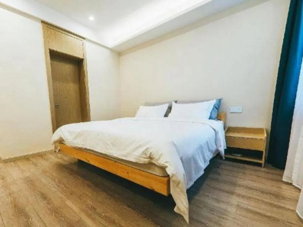 Bed in ZMAX Hotels Wuhan East Lake