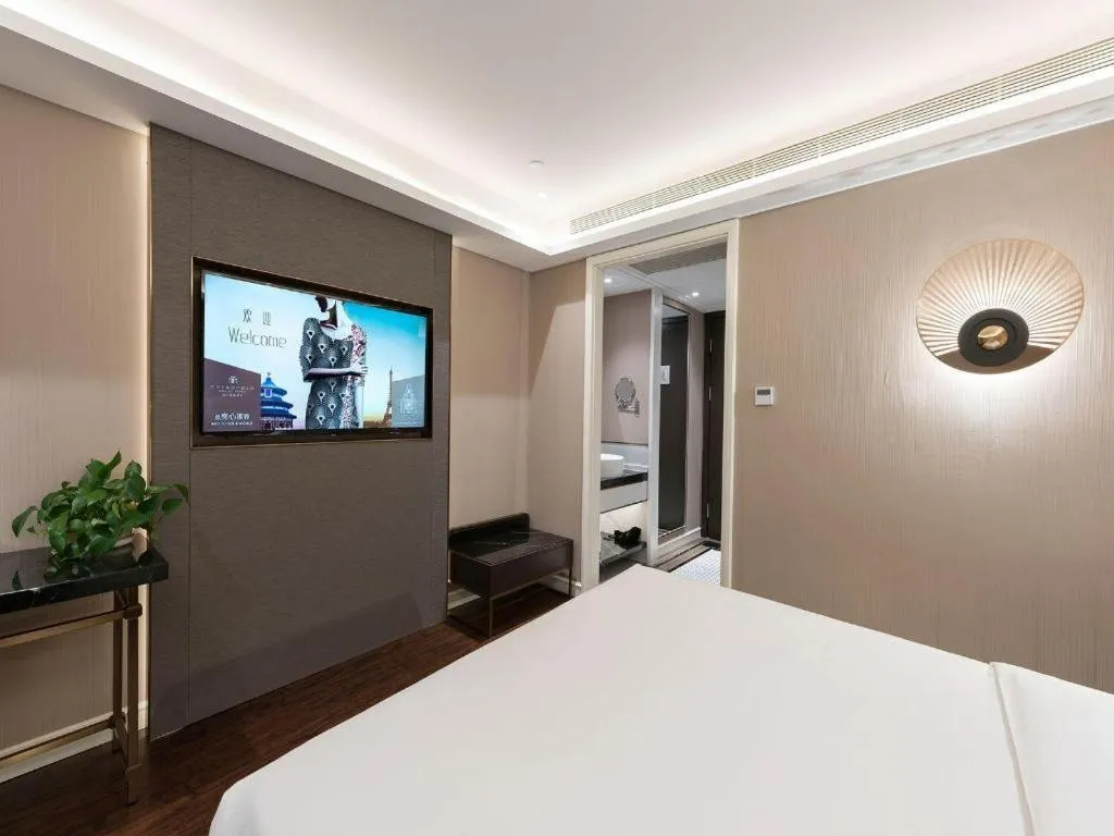 Bed in James Joyce Coffetel Harbin West High-speed Railway Station Wanda Plaza