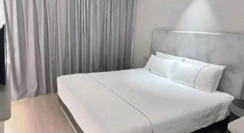 Bed in Magnotel Hotel Wuhan Jiangtan Lihuangpo Road Pedestrian Street