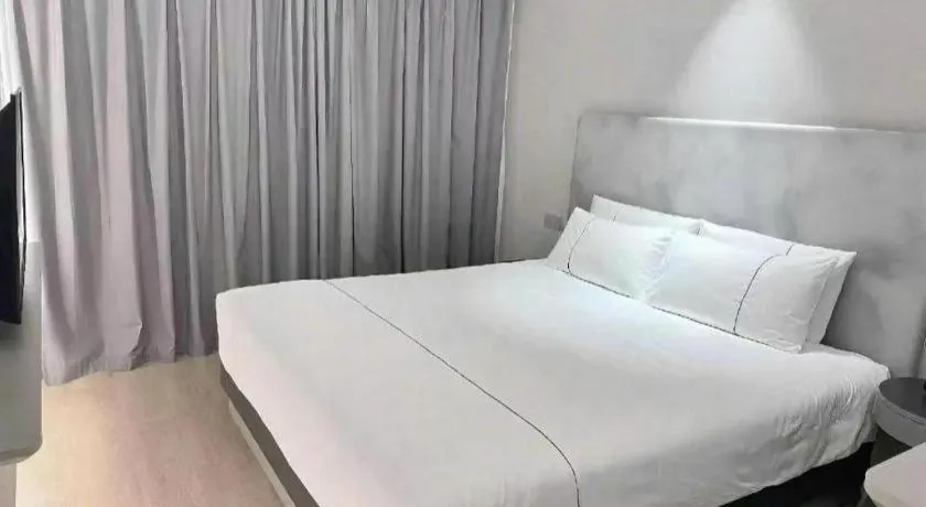 Bed in Magnotel Hotel Wuhan Jiangtan Lihuangpo Road Pedestrian Street