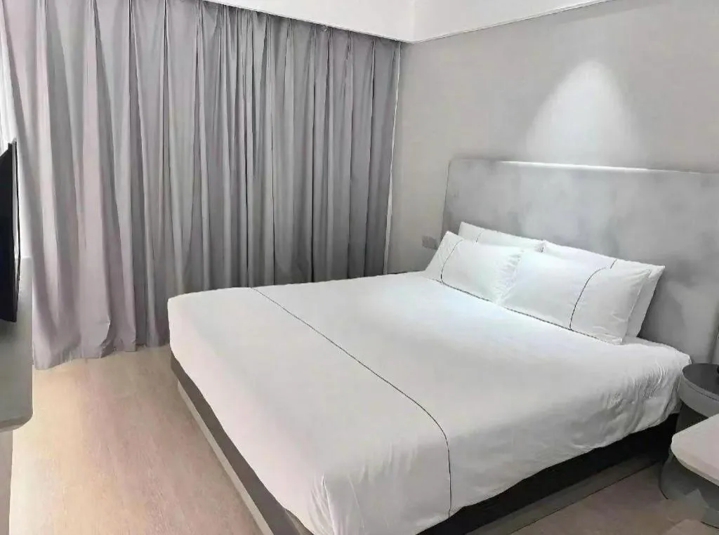 Bed in Magnotel Hotel Wuhan Jiangtan Lihuangpo Road Pedestrian Street