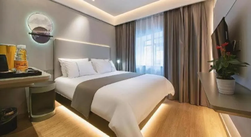 Bed in Magnotel Hotel Wuhan Jiangtan Lihuangpo Road Pedestrian Street