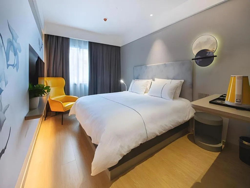 Bed in Magnotel Hotel Wuhan Jiangtan Lihuangpo Road Pedestrian Street