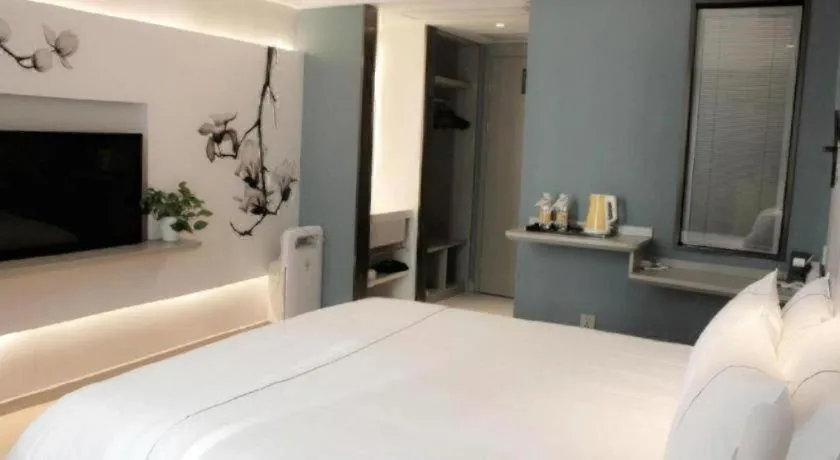 Bed in Magnotel Hotel Wuhan Jiangtan Lihuangpo Road Pedestrian Street