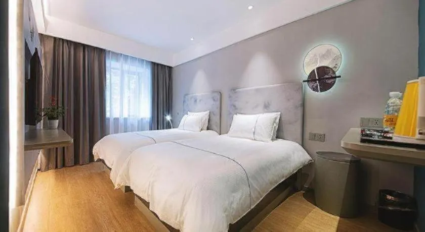 Bed in Magnotel Hotel Wuhan Jiangtan Lihuangpo Road Pedestrian Street