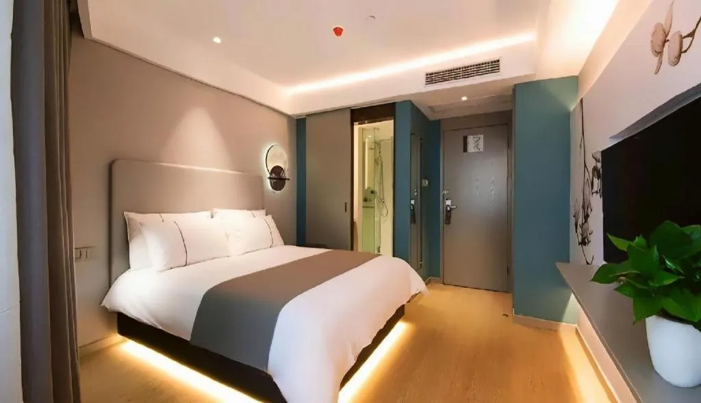 Bed in Magnotel Hotel Wuhan Jiangtan Lihuangpo Road Pedestrian Street