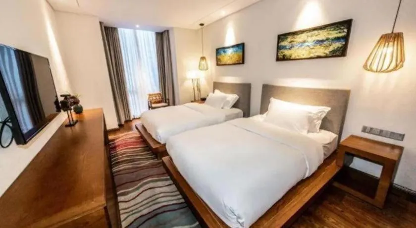 Bed in Ramada by Wyndham Guergou