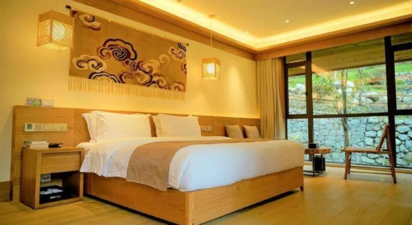 Bed in Ramada by Wyndham Guergou