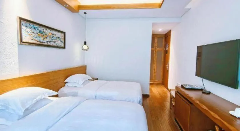 Bed in Ramada by Wyndham Guergou