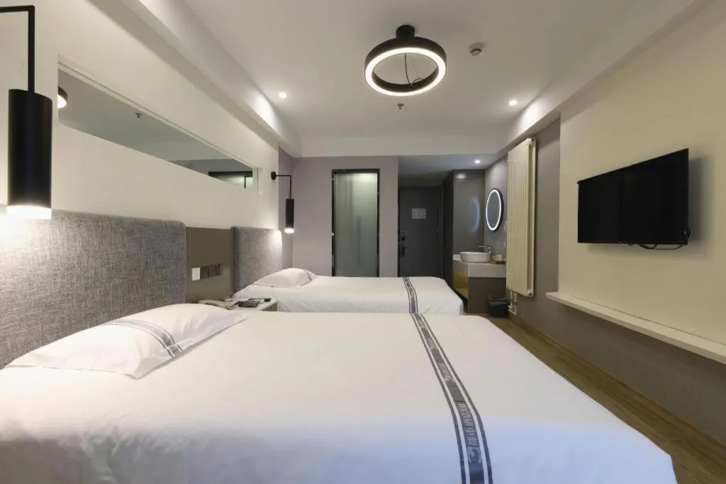 Bed in Urban Garden Hotel Chengyang District Government Liuting Airport