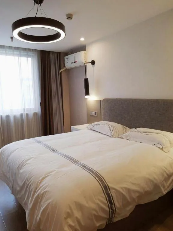 Bed in Urban Garden Hotel Chengyang District Government Liuting Airport