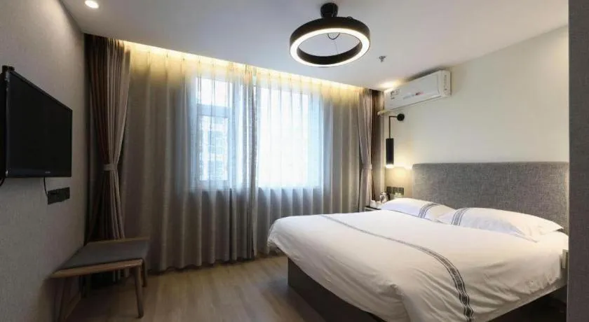Bed in Urban Garden Hotel Chengyang District Government Liuting Airport