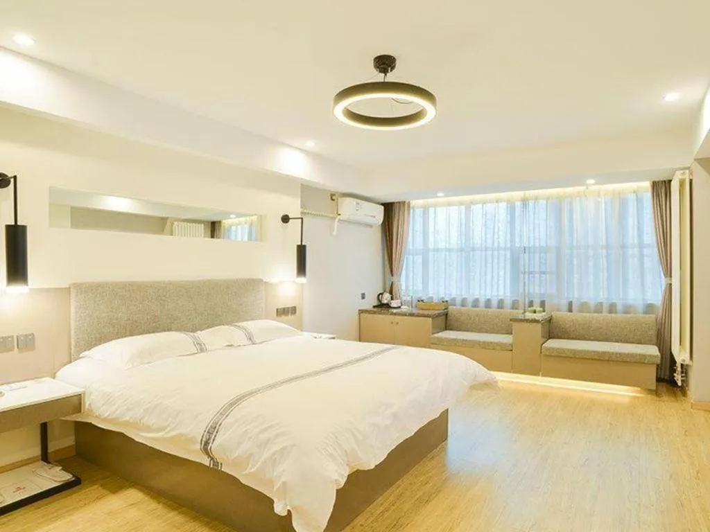 Bed in Urban Garden Hotel Chengyang District Government Liuting Airport