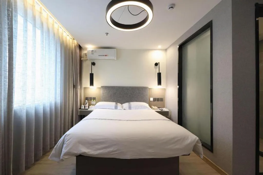 Bed in Urban Garden Hotel Chengyang District Government Liuting Airport