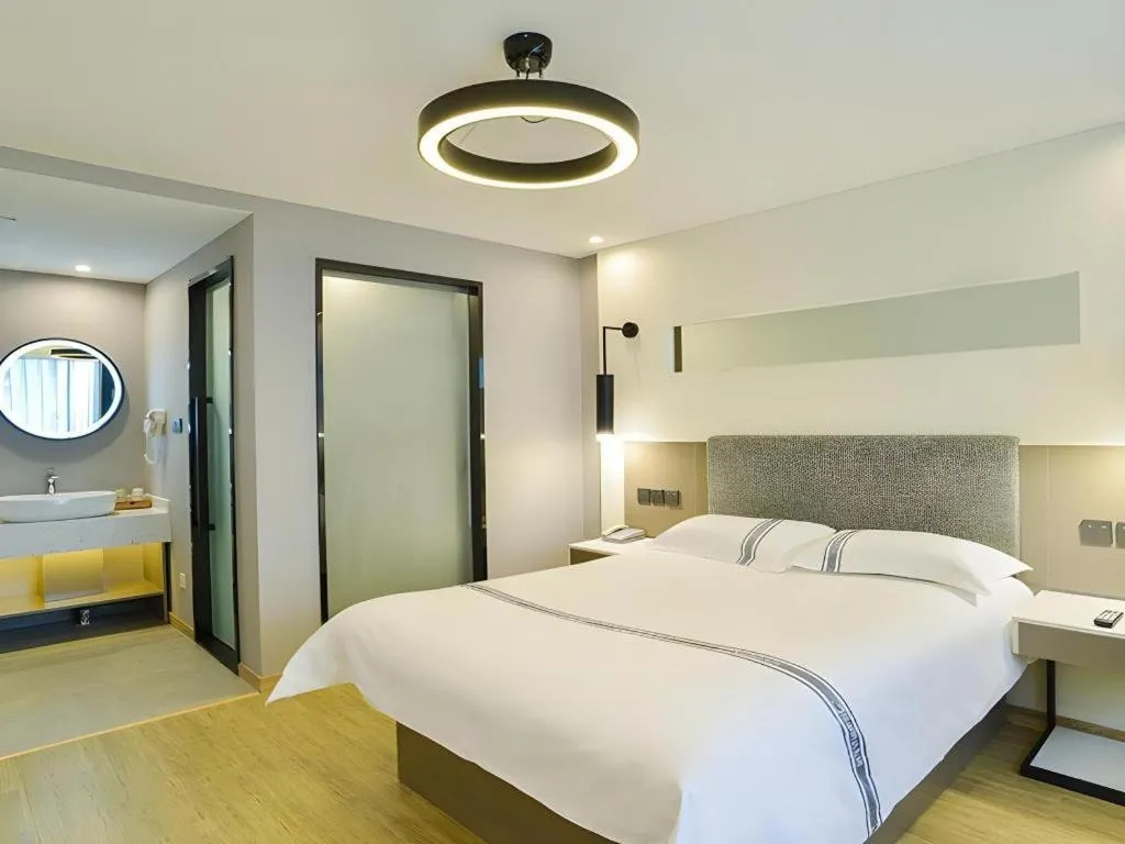 Bed in Urban Garden Hotel Chengyang District Government Liuting Airport