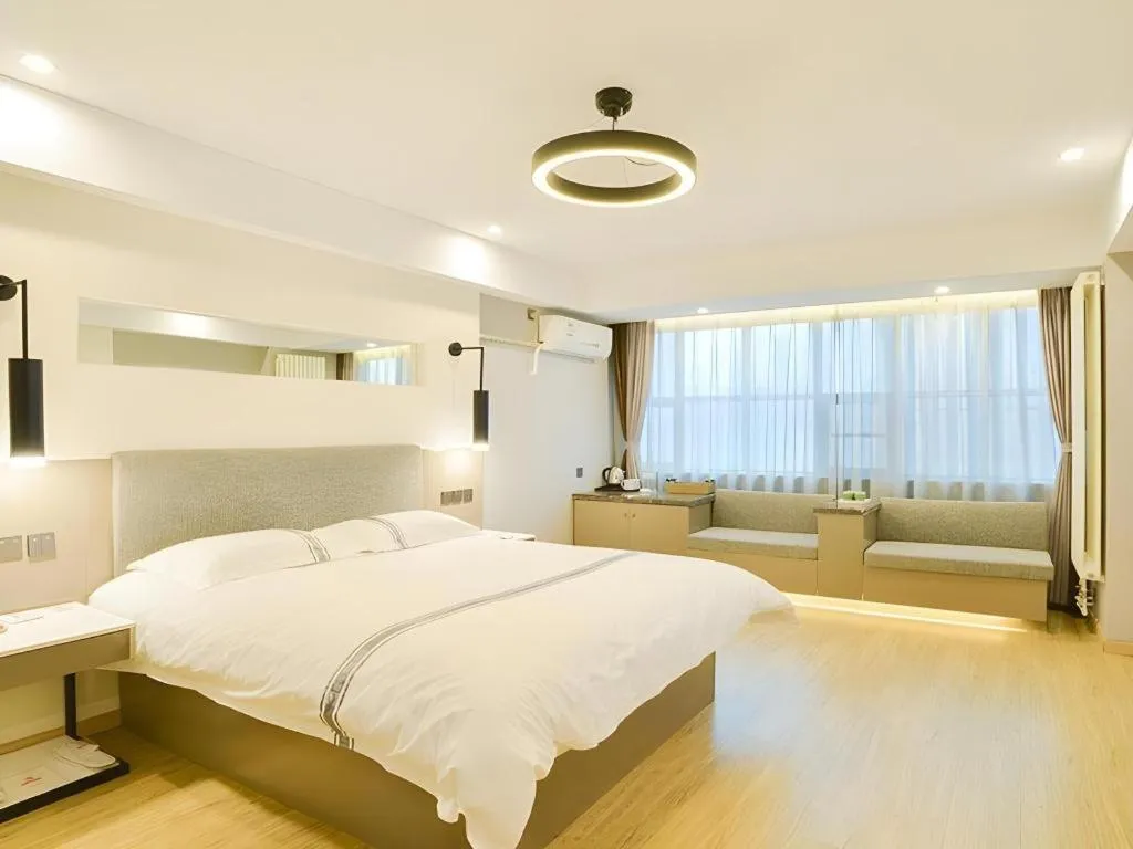 Bed in Urban Garden Hotel Chengyang District Government Liuting Airport