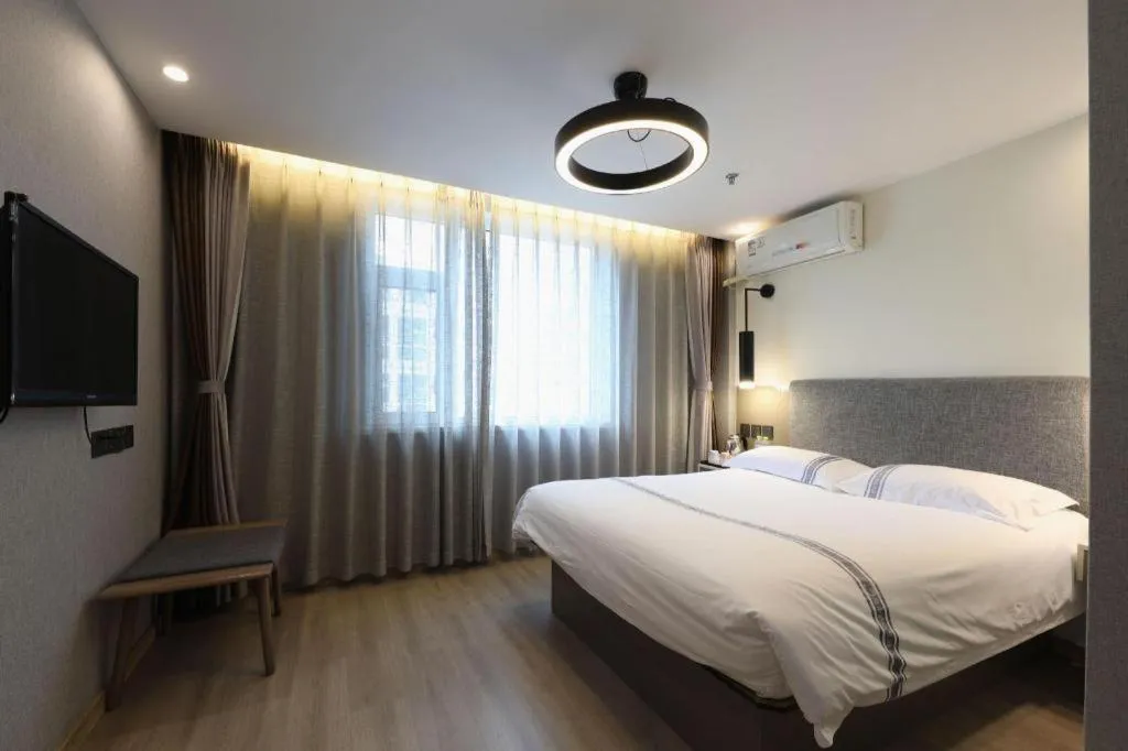 Bed in Urban Garden Hotel Chengyang District Government Liuting Airport