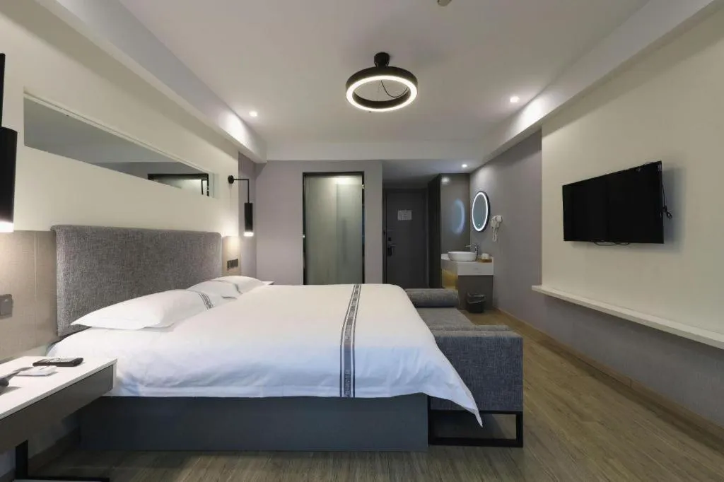 Bed in Urban Garden Hotel Chengyang District Government Liuting Airport