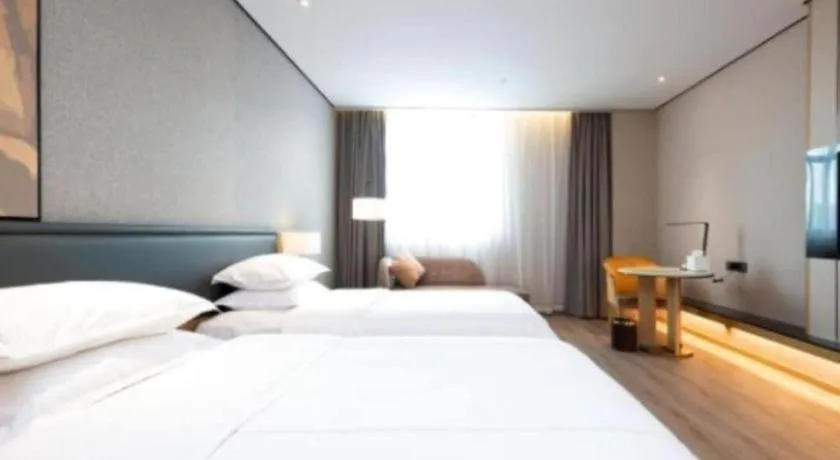 Bed in The Hotel V Nanjing Lishui